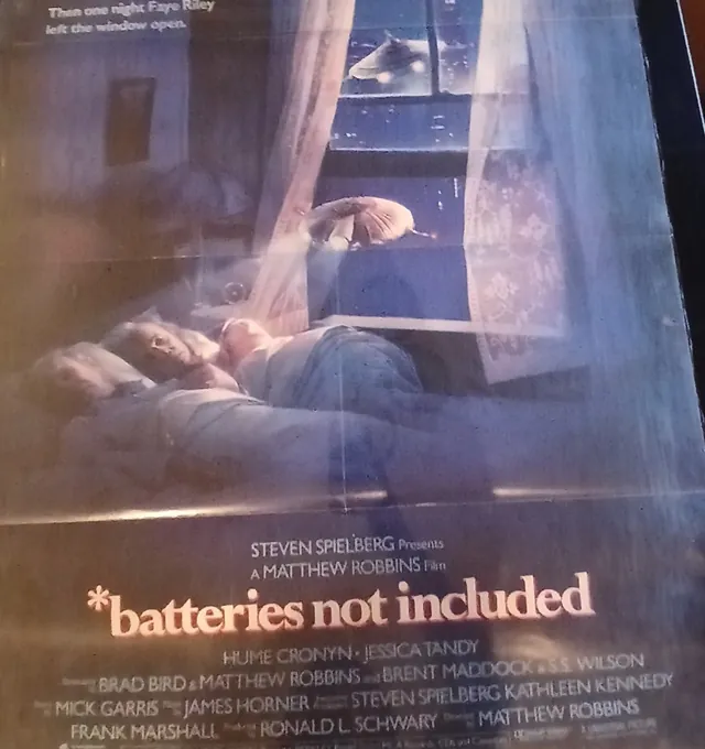 Actual *batteries not included — home-video promotional poster front photograph