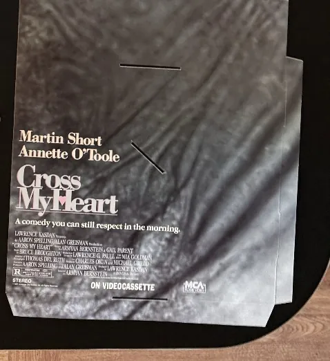 Actual Cross My Heart — MCA Home Video promo folder front photograph